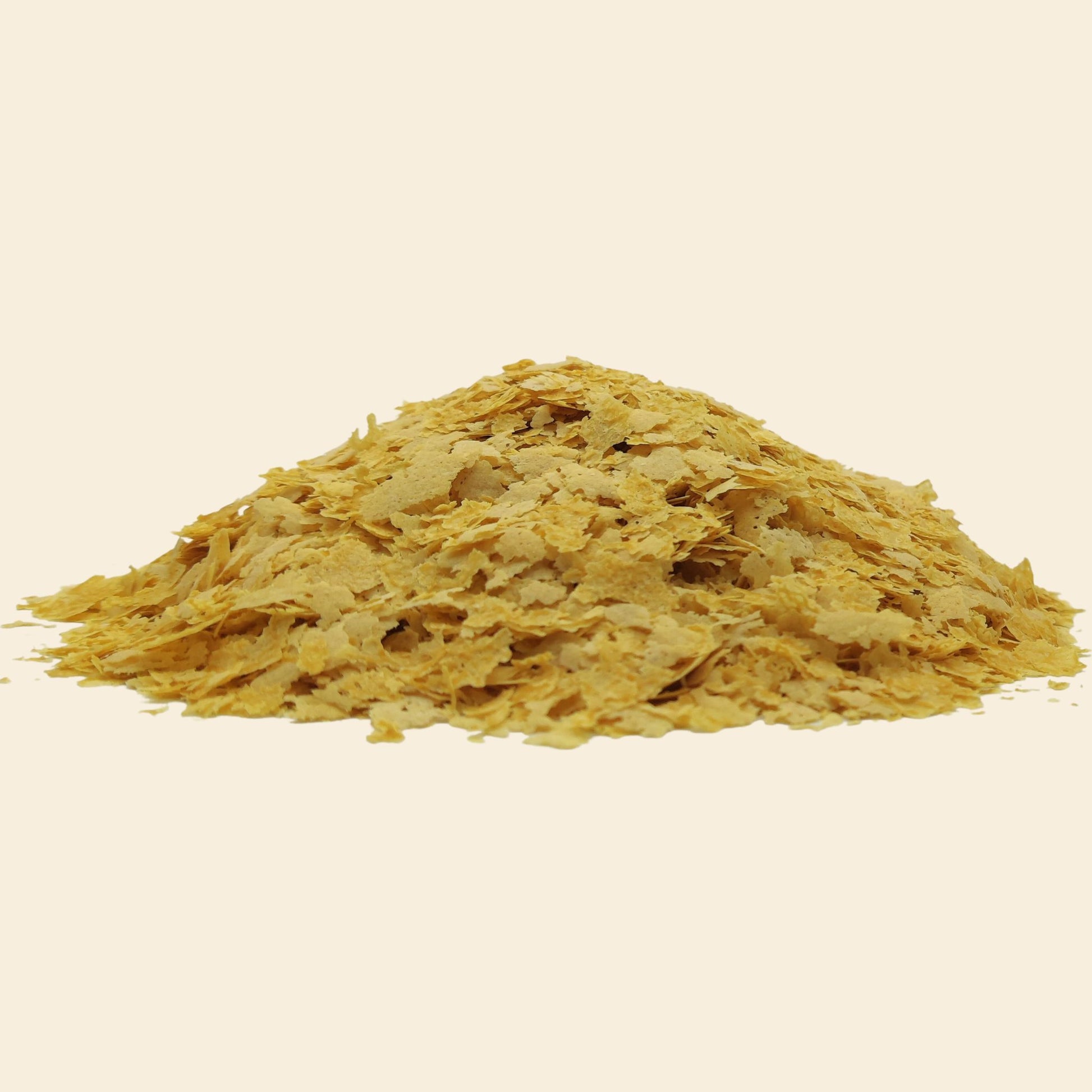 Fortified nutritional yeast flakes closeup - golden savoury superfood