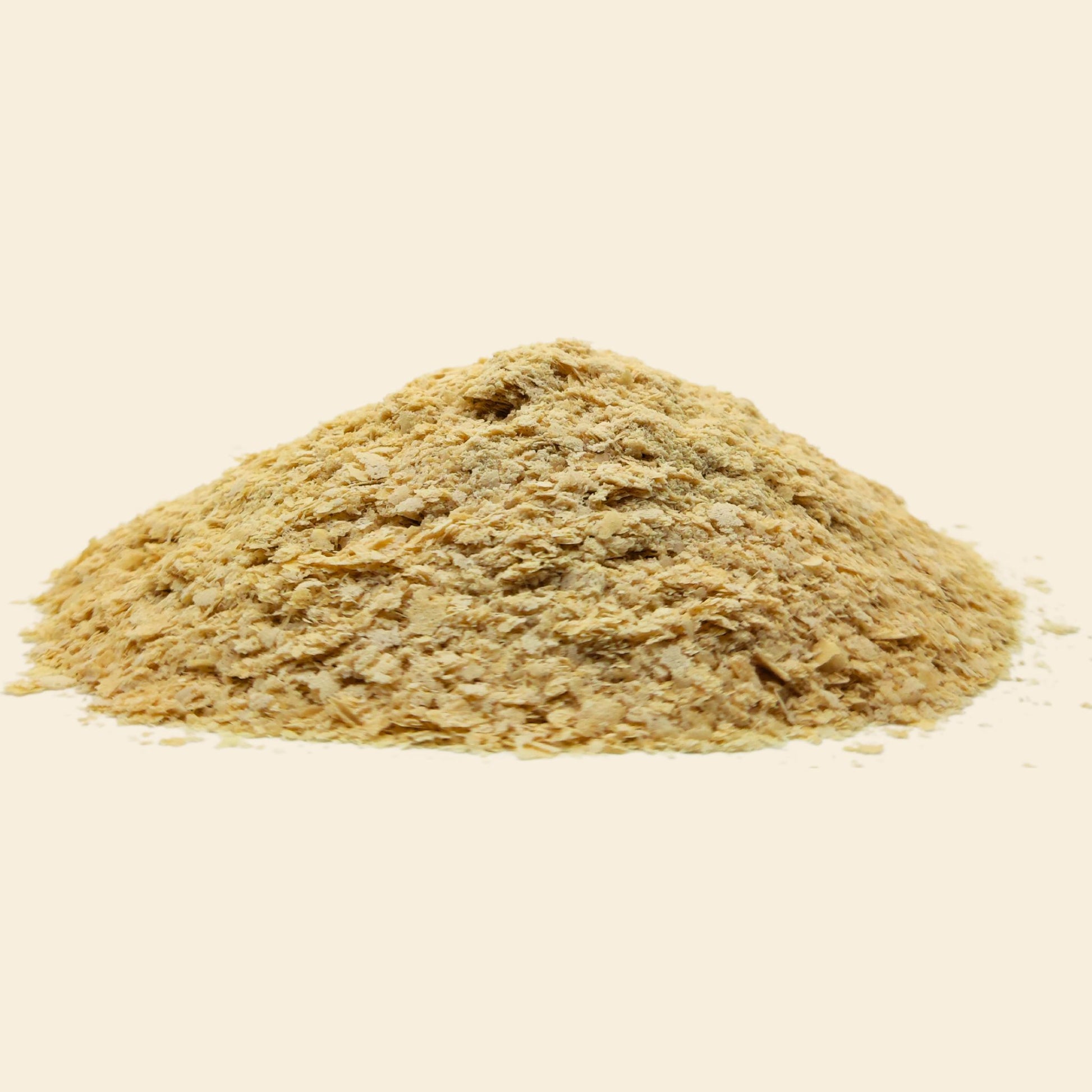 Unfortified nutritional yeast flakes closeup - golden savoury superfood